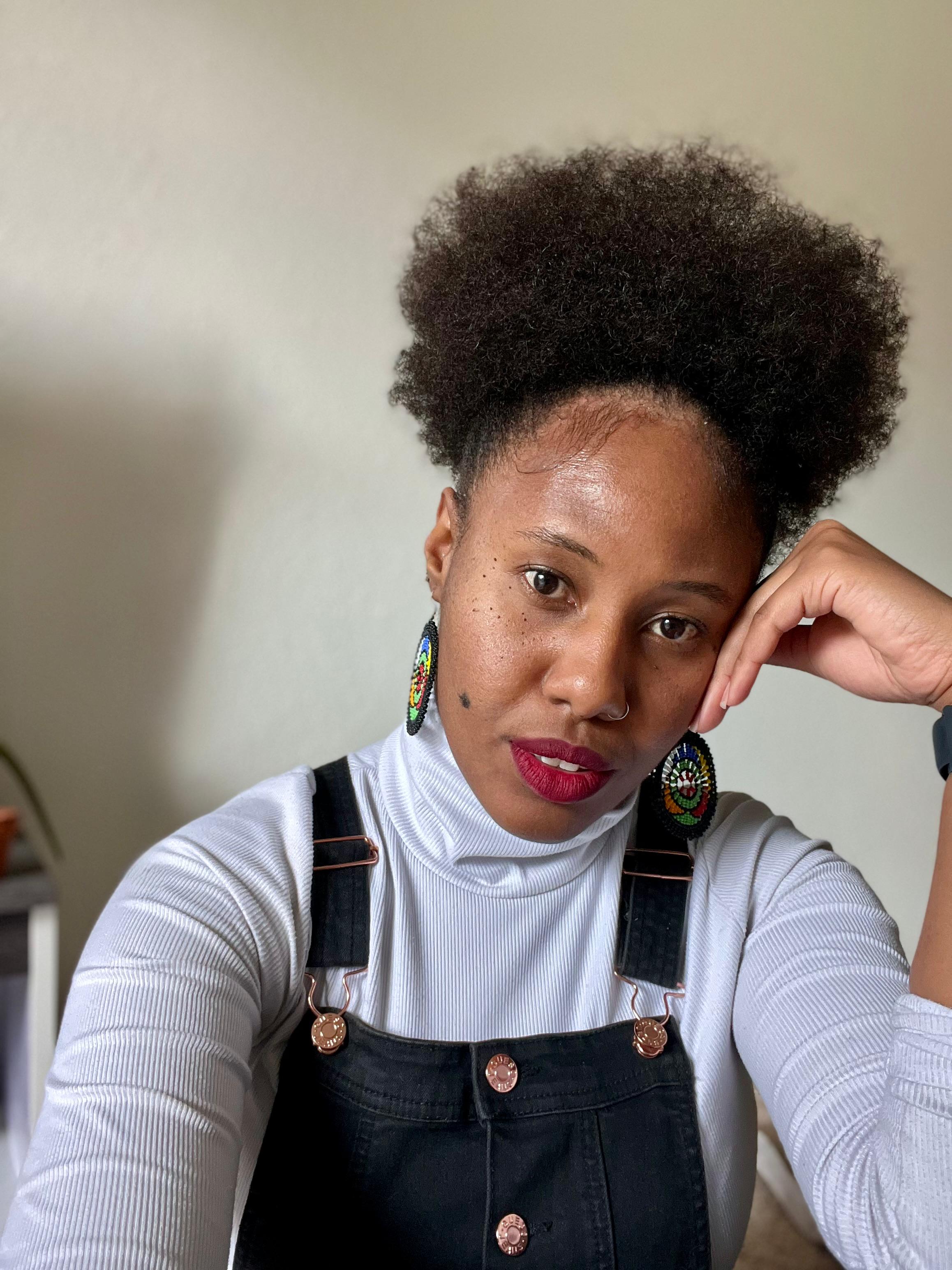 Educator of the Month Estela Gonçalves de Souza wearing a black and white shirt.