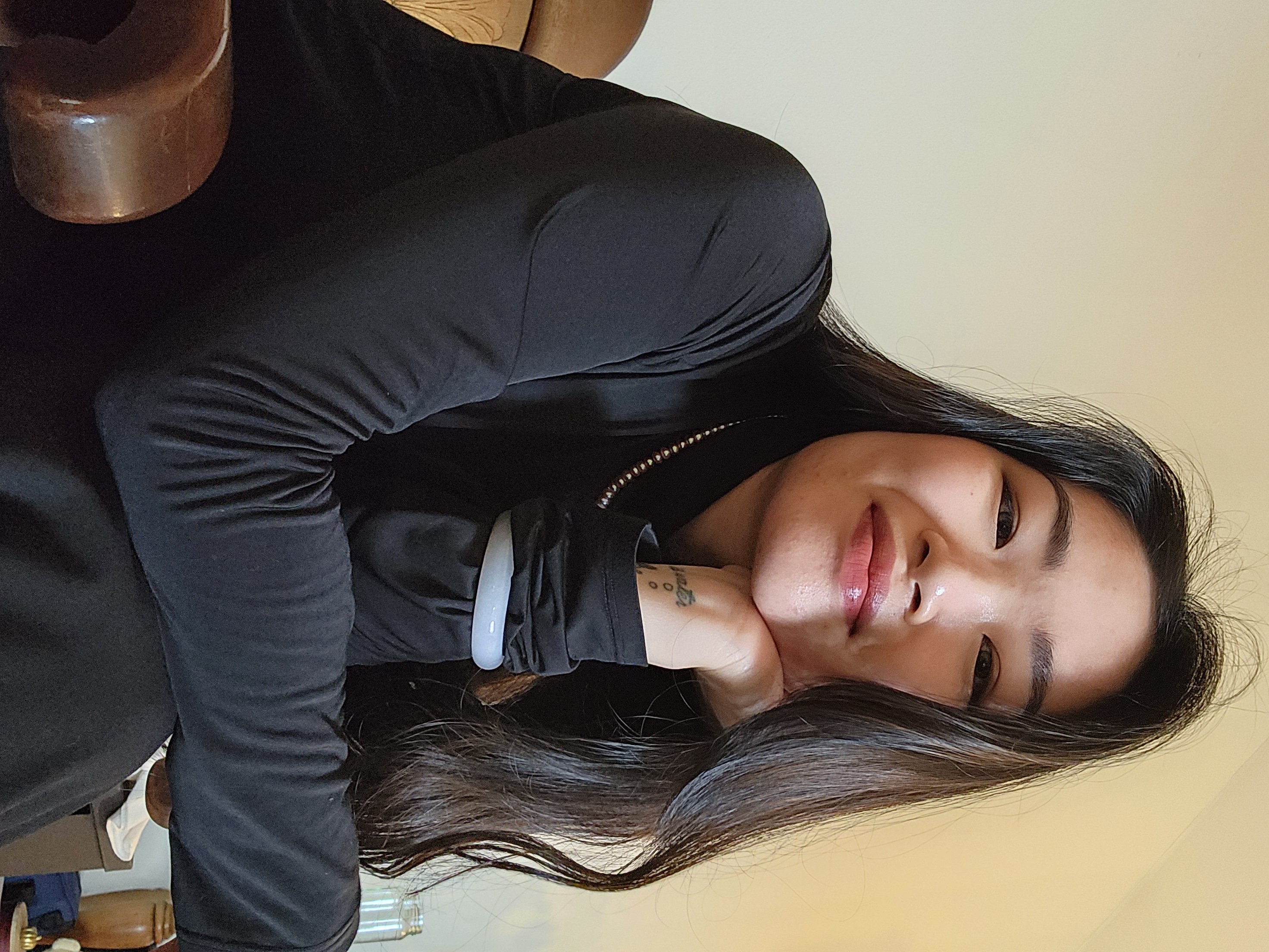 Sylvia Lin seated while wearing a black shirt.