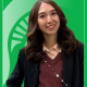 Educator of the MonthMoldir Moldagaliyeva in front of a green background with the Spartan helmet.