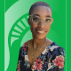 Educator of the Month Danielle Cadet in front of a green background with the Spartan helmet.