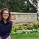 Theresa Murphy, back to school. Theresa Murphy, standing outside by the Michigan State University sign.