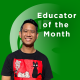 Lee Melvin Peralta Headshot Lee Melvin Peralta in a black-and-red shirt against a green background with the Spartan helmet. Text reads "Educator of the Month"